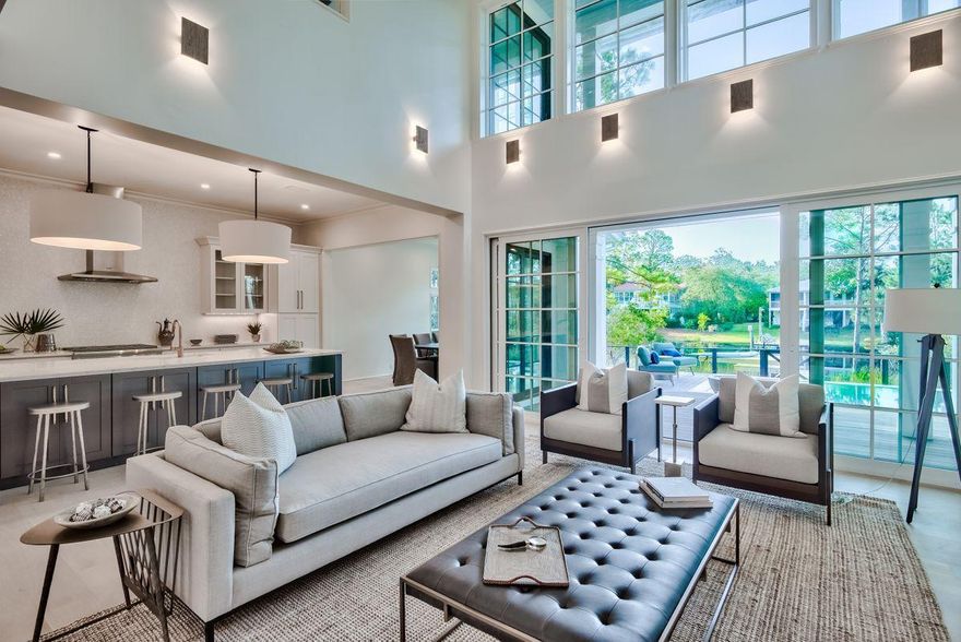 Beautiful naturalistic surroundings and prominent lake front positioning define this brand new construction designed by architect Tammy Massey and built by Arkon Group. This rare gem pairs architectural significance with stylish coastal aesthetics incorporating custom design elements and tranquil surroundings. Positioned on a quiet cul-de-sac on Eastern Lake, this home boasts over 3,300 square feet and yields four spacious bedroom suites and four and a half baths with an open living concept. Notable features of this layout include two master bedrooms each offering an ensuite bath (one on the first floor and a secondary master on the second floor), including spacious walk-in closets, floor to ceiling windows, vaulted ceilings and panoramic water views. High attention to detail is evident