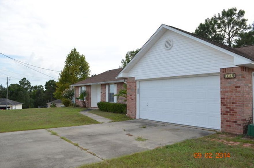 If you are looking for an affordable, accommodating, move in ready home in south Crestview, then move on in. This property is ready to go. Tile throughout most of this home with carpet in the bedrooms. Home is split bedroom design with large master bedroom and oversized master bath with double vanities, garden tub, separate shower and his and her walk in closets in the bath. Need extra room in the laundry room? Got it. Laundry is larger than most and has plenty of room for extra storage. The living room has a plant shelf and opens to a covered patio. A level lots with lots of room to grow. This property is priced to sell. Call today!