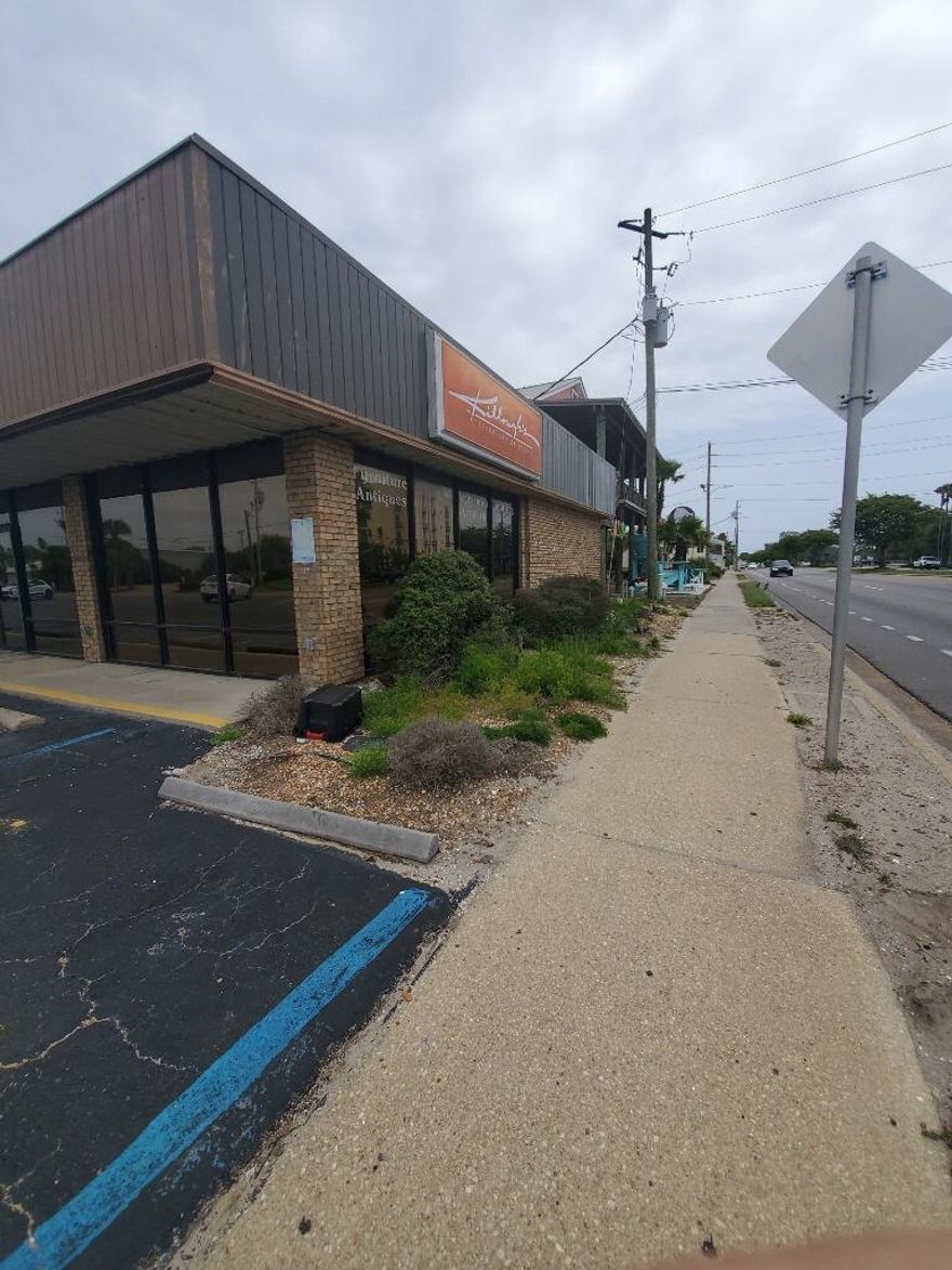 This exceptional retail/office/professional space occupies the prominent front corner of the complex! It boasts ample space and abundant natural light, with vertical windows overlooking Harbor Blvd and the parking lot. Previously utilized as an interior design studio, this unit features cathedral ceilings, a reception area, a main office, a kitchen, storage, and a bathroom.  There is an additional monthly fee of $100 for water/sewer/trash.  Please contact our office to set up a time for your private showing:  850-244-2100 x-0