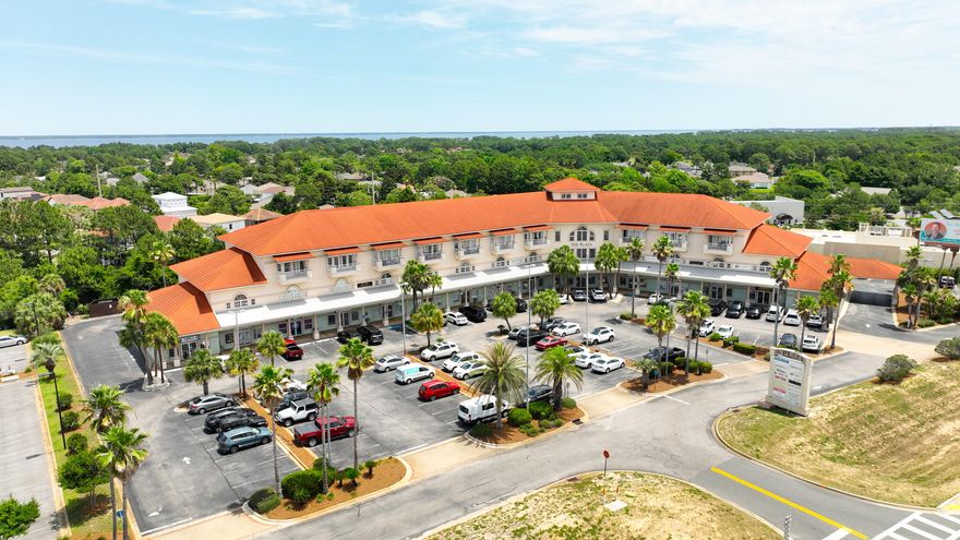 Destin Florida Live here work here mixed used complex 'The Plaza'Discover the perfect blend of space, comfort, and convenience in this 1,801 sq. ft. two-story condo, 3rd floor condo with Lobby elevator, ideally situated in the heart of Destin. Just a short drive from the breathtaking Emerald Coast beaches, this home places you steps away from City Market Bayside and Destin ER, and right between two major shopping and dining hubs--Destin Commons and Silver Sands Premium Outlets.Inside, you're welcomed by dramatic 20-foot vaulted ceilings that open up the living and dining area, creating a bright, expansive feel. The kitchen connects seamlessly to the main living space, complete with a breakfast bar for easy entertaining or quick meals.Destin Florida Beaches are yours here to enjoy. The downstairs primary suite opens to a private balcony via elegant French doors and includes a spacious en suite bath with a double vanity, walk-in closet, jacuzzi tub, and walk-in shower. A guest bedroom also enjoys balcony access, while a third full bathroom in the hallway adds comfort for visitors.