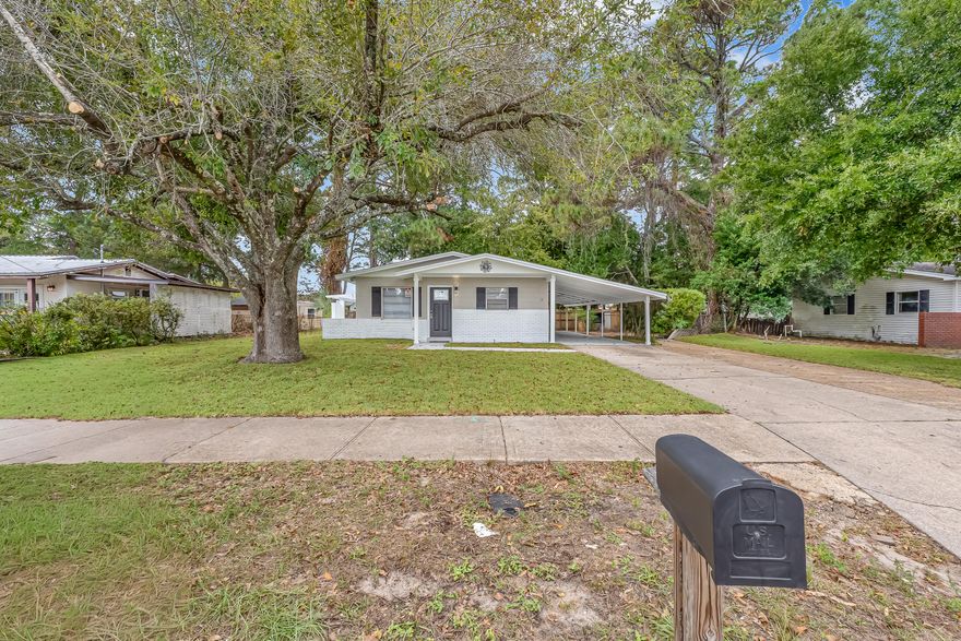 Welcome to 12 Memorial Parkway NW, a beautifully updated Mid Century Ranch home in the heart of Fort Walton Beach. This solid concrete block and brick residence blends timeless charm with modern finishes inside and out.Step inside to find fresh paint throughout, new waterproof LVP flooring, and updated baseboards that create a clean, contemporary feel. The spacious living area flows seamlessly into a bright, fully renovated kitchen featuring white quartz countertops, all new cabinetry, stainless steel appliances, and a convenient pantry for extra storage.Just off the kitchen, you will find a dedicated laundry room with a washer and dryer included, offering added convenience. The home's bathroom has been completely remodeled with a new deep soaking tub, porcelain tile surround, a floating vanity sink, and a LED lighted mirror which gives it a spa like touch.

Additional updates include new interior and exterior doors, a new water heater, and a roof that is only six years old, ensuring peace of mind for years to come.

Outside, enjoy your own backyard retreat with a pergola and seating area, complete with a stainless steel BBQ grill, patio table, and chairs, perfect for entertaining. The fenced in backyard provides space for children or pets to play, while the two car covered carport offers convenient and sheltered parking. The yard features lush St. Augustine sod for great curb appeal.

This home is move-in ready and ideally situated for easy access to shopping, schools, and beautiful Emerald Coast beaches.