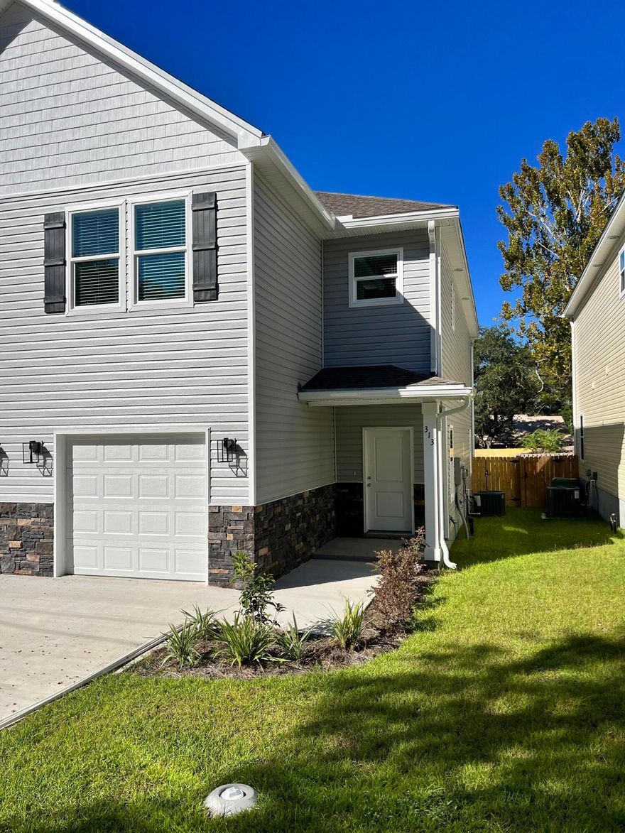 Great location in the heart of Niceville! This 3 bedroom, 2.5 bath home has all the features! Stainless appliances, impact windows and doors, fenced yard, vinyl plank flooring on the main floor. This brand new home features a spacious open floor plan with living and dining areas and the kitchen has a breakfast bar, lots of cabinets, quartz counters, a pantry and all appliances. Upstairs you'll find an oversized master suite with an attached bath and walk-in closet. The master bath has a separate shower and soaking tub with a private water closet. Two additional bedrooms share a bath and the laundry area is located upstairs.  Standard one year builder warranty included.