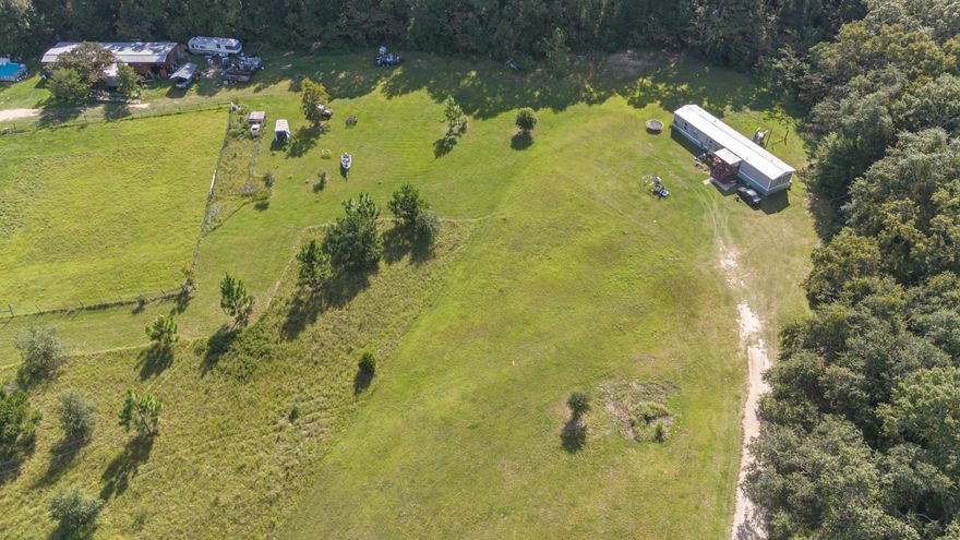 Low E Galvalume Roof replaced in 2021. Wind Mit report available. FRESHLY PAINTED & NO MORE POPCORN CEILING! Nestled on a sprawling 2-acre canvas of tranquility, this charming 3-bedroom, 2-bath home is your gateway to serene country living. Imagine waking up each day to the soothing sounds of nature, with ample space to cultivate your dream garden, host unforgettable gatherings, or simply watch your children and pets explore and play in the vast, open surroundings.As you step inside, you'll be greeted by a bright and inviting living space that exudes warmth and comfort. The kitchen, the heart of the home, offers abundant countertop and cupboard space, perfect for preparing family meals or hosting casual breakfasts in the cozy eat-in area. The generously sized master bedroom is your personal retreat, complete with an en suite bathroom featuring a luxurious garden tub - perfect for unwinding after a long day. Two additional well-appointed bedrooms provide ample space for family, guests, or even a home office, while a second full bathroom ensures everyone's comfort.

Convenience is key with a dedicated laundry space, making household chores a breeze.

But that's not all - this property is part of a unique, rare opportunity for multi-generational living! An adjoining 4-bedroom, 2-bath home sitting on an additional 3.7 acres is also available, creating the perfect setup for extended family or investment potential. Imagine the possibilities - shared family memories, separate yet close-knit living arrangements, or even rental income.

Don't miss out on this once-in-a-lifetime chance to get your slice of country paradise with the added benefit of multi-generational living. Schedule your private tour today and start picturing your new life in this idyllic setting!

