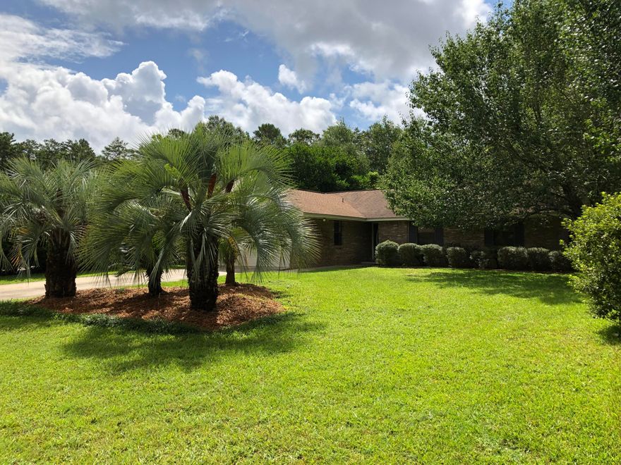 Drumroll!!!!! This is the home you are looking for! A home for any one in any walk of life! Located in Bluewater Bay and a short walk to shopping and restaurants. Lovely 3 Bedroom, brick home with fireplace, large living room with hardwood flooring. No HOA! On a Cul-de-sac. No popcorn!! Eat in Kitchen!! Large master bedroom and bathroom. Lovely mature back yard with scented wisteria covered arbor over the patio. Yard is very private and fully enclosed with privacy fence. No back yard neighbors! Japanese Magnolia. azaleas, kumquat, hybrid lime and loquat trees. Yard building with electricity and wood flooring! Flood lights in back and front with switches in kitchen and master bedroom. Room for a pool! Home warranty provided.