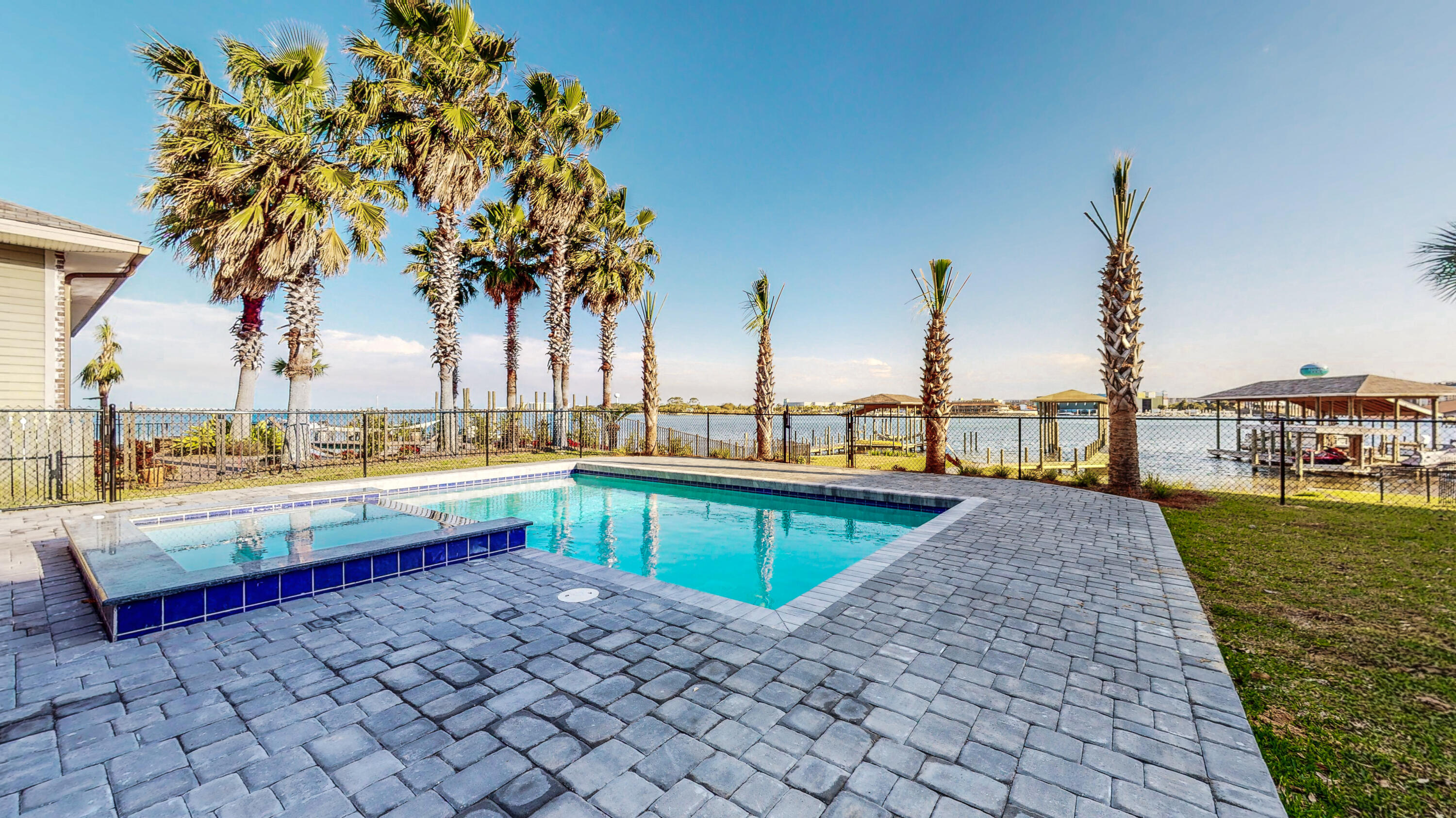 Magnificent Waterfront home, Fully remodeled Custom built 2012 home is situated on a 1/2 acre lot with a prime waterfront location overlooking the Intracoastal Waterway in the sought after Elliot Point neighborhood. Home has 6 rooms...5 bedroom 3.1 bath plus an extra room for a office/playroom/study. ect. As you enter through the front door you are immediately drawn to the Amazing water view. The sunsets are Sooo amazing and will draw you to the large back covered porch complete with the in-ground gunite salt water heated pool and hot tub.