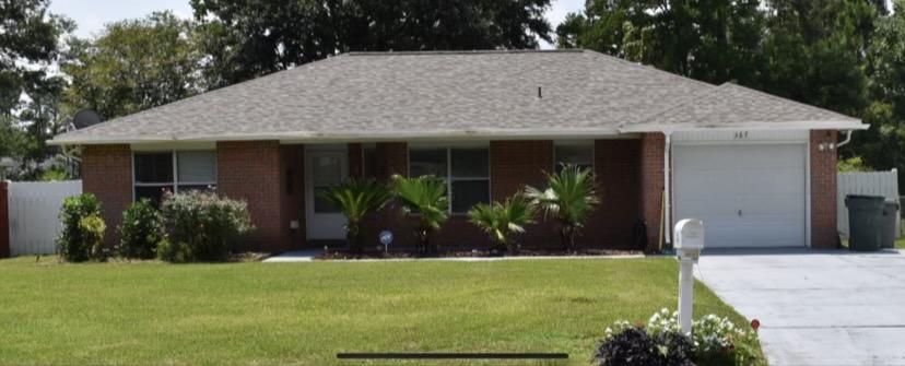 Location, Location, Location!!! All brick home with inviting porch. Great westside location . Close to Beaches and NAS. This home features 3 Bedrooms, 2 Baths, a 1 car garage, Security System, Sprinkler System Granite countertops in Kitchen and Bathrooms. Roof Replaced in April 2021.