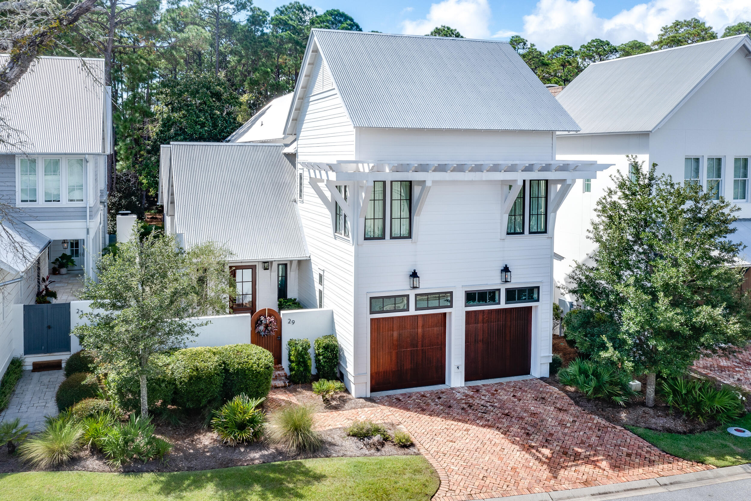 This stunning Geoff Chick designed, Coastal Custom built 4 bedroom, 4.5 bath custom home features first and second level master suites, open floor plan, living room areas on first and second floors, private pool and courtyard with outdoor kitchen, and high end finishes throughout. Beautiful white painted brick and Hardie board exterior are home to brick and reclaimed heart pine floors, marble kitchen and baths, and a desirable floor plan that's perfect for primary or second home ownership. Call today to learn more and to schedule a private showing.