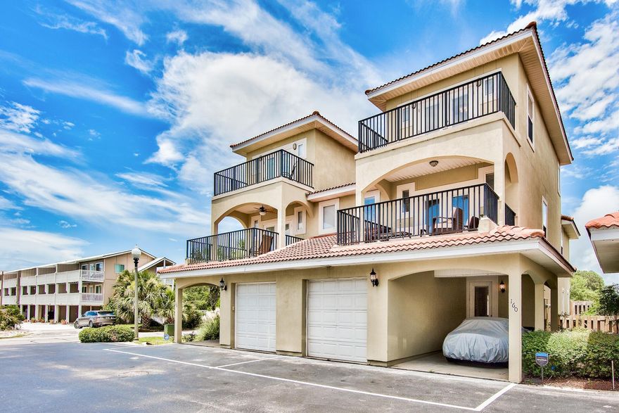 Located on the west end of PCB this beautifully maintained Mediterranean style townhouse is in a low density community. Bella Costa is one of the most sought after complexes on the west end with units rarely coming available. This turnkey full-time residence or vacation rental is just a 5 minute walk to the beach and steps from the pool, and comes fully furnished with Gulf views. Main living area is on the ground floor with one car garage and carport for your second car or golf cart. This 4 bedroom 4 bath has balconies on each level with gulf views. Home has stainless appliances, granite countertops, tile floors, Bosch washer and dryer, crown molding, tile roof, and many upgrades to include: Three new HVAC systems, recently painted exterior, new patio deck off ground floor, exterior doors