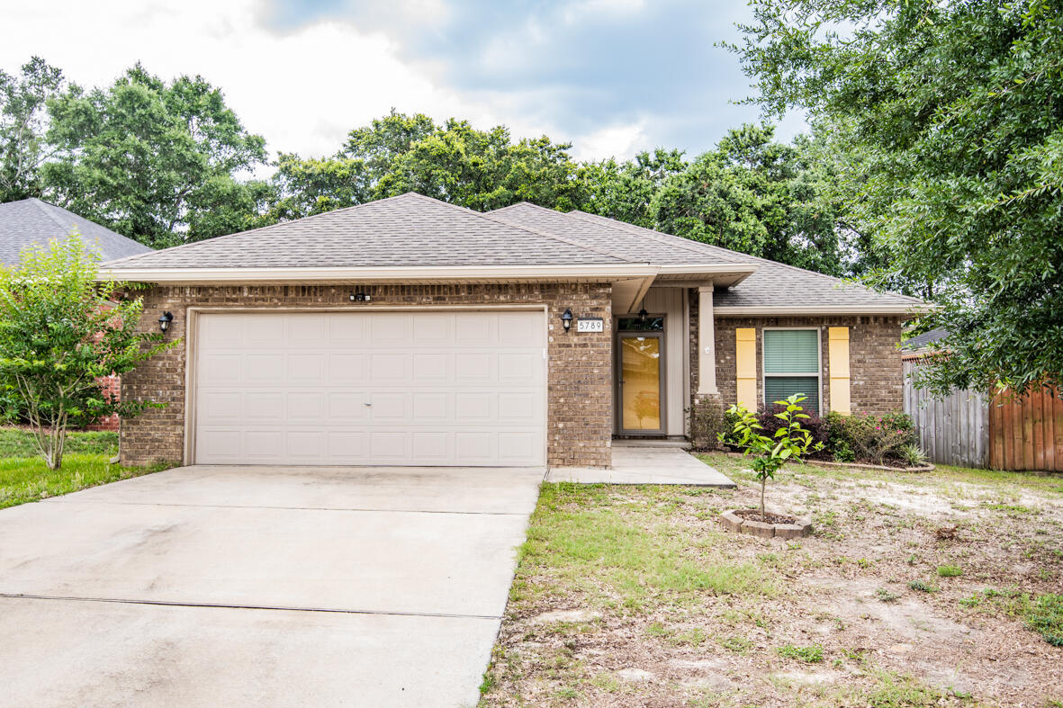Available 6/12/23! This 3/2 is conveniently located to Pensacola, Avalon Blvd, shopping, dining, and 30 minutes from the beach! This fabulous home has been recently updated with LVP tile in main living and kitchen area. Master bedroom features tray ceiling and large master bath with separate shower, garden tub and double vanity. An eat at bar area opens to living room. Kitchen features beautiful wood cabinets and granite counter tops! Bedrooms are good sized with ample closet space. The backyard is the PERFECT entertaining space for cookouts and get togethers, Washer and Dryer are As-Is. No cats allowed but dogs are allowed under 30 lbs, with a $400 non-refundable pet fee. No smoking or vaping inside. Applications are done online at www.rentgoodlife.com