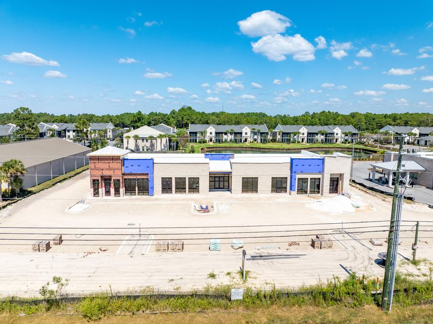~11,246 Square Foot Subdividable Building with a Drive-Thru!  (listing price involves the anchor space at +/-4,155 square feet) 239' of Highway 98 frontage enjoying the benefits of an existing deceleration lane and access to a traffic light!  One of the most premier sites located in South Walton County of Santa Rosa Beach, Florida. This 1.5-acre parcel, zoned Village Mixed Use, is identified on the uploaded plat as 'Parcel B' of the mixed-use development known as The Shops of 393. This outparcel commands significant visibility from a traffic count of approximately 45,000 vehicles daily. Please inquire for further details.