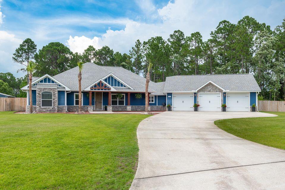 Gorgeous Custom built home with so many extras on 1.38 acres. 4 bedroom 2.5 bath. As you walk to the beautiful upgraded front door you will notice the front porch has been upgraded with a wood look stamped concrete. As you enter the home to the right & left you have a flex space with custom built-ins that could be used as an office, den, game room, etc. This home boasts 11 ft trey ceilings in the living room and primary suite. Kitchen is a cook's dream with Wolf Induction Stove Top & upgraded Viking appliances, custom soft close cabinets & drawers topped with beautiful granite countertops and tile backsplash. Large island with Black Walnut butcher block and farmhouse sink. Walk-in pantry with wood shelves. Split floor plan allows for privacy for the primary suite & primary bathroom
