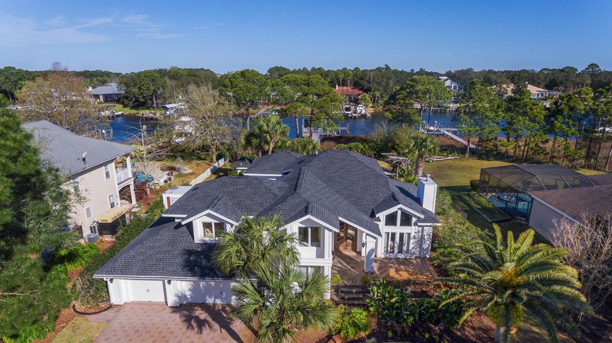 A rare find in Destin. Beautifully remodeled 3800 sq ft waterfront home with a massive DEEP WATER DOCK, near the entrance to Indian Bayou.  The 60' boat slip and a 20k boat lift are ready for nearly any size boat.  Indian Bayou has a well marked deep-water channel leading to Choctawhatchee Bay, and is only a short ride to Crab Island, Destin Pass and the Gulf of Mexico. The home has been fully remodeled inside and out. The incredible Chef's kitchen and updated master bath are the highlights inside the home, as well as a huge bonus room. Other updates include A New Roof, HVAC, Flooring, and new paint inside and out. The pool has been resurfaced and a new pool deck installed. There is also a detached pool bath on the back patio.