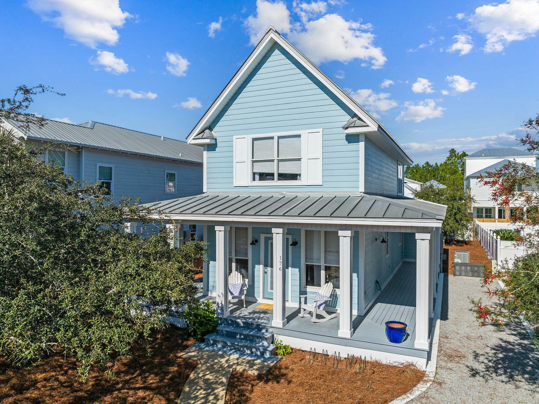 Nestled in the heart of Seagrove Beach, Southern Breeze offers the perfect blend of coastal charm and modern convenience. Located just 200 yards from the sugar-white sands and emerald waters of the Gulf of Mexico, this beautifully updated four-bedroom, three-and-a-half-bath cottage in the sought-after Village of Sugar Beach is an idyllic retreat for beach lovers and savvy investors alike. Situated on a spacious 0.15-acre lot, the home features a newly added first-floor master suite and screened porch.  The large lot provides ample room for a future pool, while the wraparound porch invites you to relax and savor the gentle gulf breezes. Inside, an open floor plan welcomes you with updated flooring, fresh appliances, and a tankless water heater for modern comfort. The second floor boasts soaring 12.5-foot ceilings, a king suite and two additional bedrooms, perfect for accommodating family and guests. The thoughtful layout ensures comfort and privacy for all, whether hosting a gathering or enjoying quiet moments on the porch. The Village of Sugar Beach is a quiet, partially gated community with no through streets, creating a safe and peaceful environment. The neighborhood pool and proximity to local shops, restaurants and the vibrant town of Seaside, Florida, make this location unparalleled. A short walk brings you to the gulf, and biking trails at nearby Deer Lake State Park offer endless outdoor adventures. Whether you're seeking a turnkey vacation rental, a second home or a permanent residence close to the beach, Southern Breeze provides the perfect opportunity to live the quintessential 30A lifestyle.