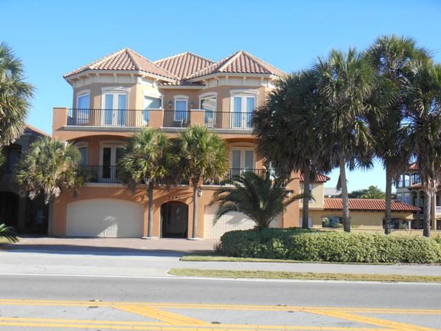 This well maintained 3 story 7BR/7.5BA, 4983 sq. ft. Mediterranean style home offers liberal interior living and entertaining space, magnificent views from several large balconies, elevator, outdoor grill, heated pool and hot tub, generous closet and storage areas, Travertine flooring, tile roof and the list goes on. Did I mention this property is located directly across the street from the most beautiful white sandy beaches and emerald blue water the Gulf of Mexico has to offer. Plus on the North side the property there is 40' of waterfront on Lake Destiny. This Beautiful Vacation Rental property is being sold completely furnished. Considering the owner's heavy use this property has an excellent rental history. If important please verify all dimensions.