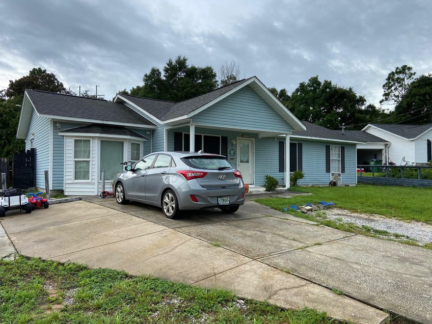 This 3 bedroom 2 bath home, plus an office, sits on an expansive lot and has a freshly painted interior. The office could serve as a 4th bedroom if needed. Very cute small cul du sac neighborhood and the house has a great floor plan! There is a combination pantry and laundry room off the kitchen. The office sports a large bay window. There are 3 outbuildings at the rear of the property, two with electricity.  One, used now as a ''man-cave'' and a separate shop and a storage shed. The back yard has plenty of room for a pool and there is a screened porch that looks out across the yard from the rear of the home. Plenty of parking in the expanded parking area at the front of the house for cars, boat or other toys! This home has tons of potential and is ready for you to add your personal touches