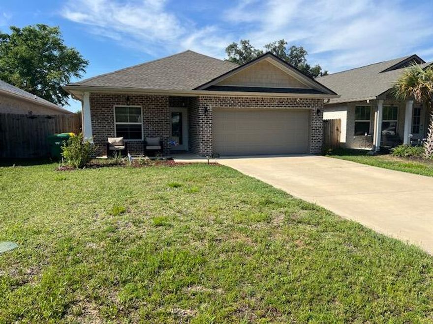This 4/3 custom brick home has super curb appeal. There are 10 Ft. Ceilings w/ impressive crown molding, has LVP flooring throughout most of the home except for the wet areas which are tiled. The gourmet kitchen boasts white cabinetry, granite countertops, a breakfast bar and stainless appliances. Bedrooms 1 and 2 are located near the front entry. The master suite is located at the rear of the home and has a double vanity, 2 walk -in closets, and a combo tub and shower with a glass enclosure. The oversized great room is located at the front of the kitchen and opens to a covered patio. Yard is fully sodded and fenced and comes complete with a well and sprinkler system and lawncare included in rent.