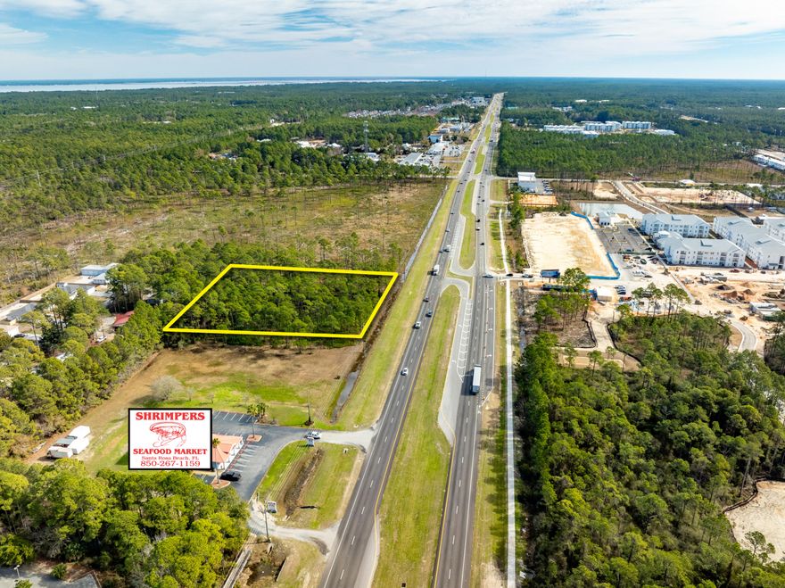 NEW LISTING of Prime Commercial Vacant Land in Santa Rosa Beach, Florida!This +/-2.118-acre site spans +/-279' along Highway 98, adjacent to Shrimpers Seafood to the West, and adjacent to the East is +/-145 acres of State Forest.  Zoned Village Mixed Use, this acreage offers a multitude of viable end-uses.  The current conceptual site plan illustrates a medical facility and a separate pharmacy building with a drive-thru.  The civil engineering for ingress and egress is superb, offering a median cross-cut for the benefit of Eastward-bound traffic. Please inquire for further details.