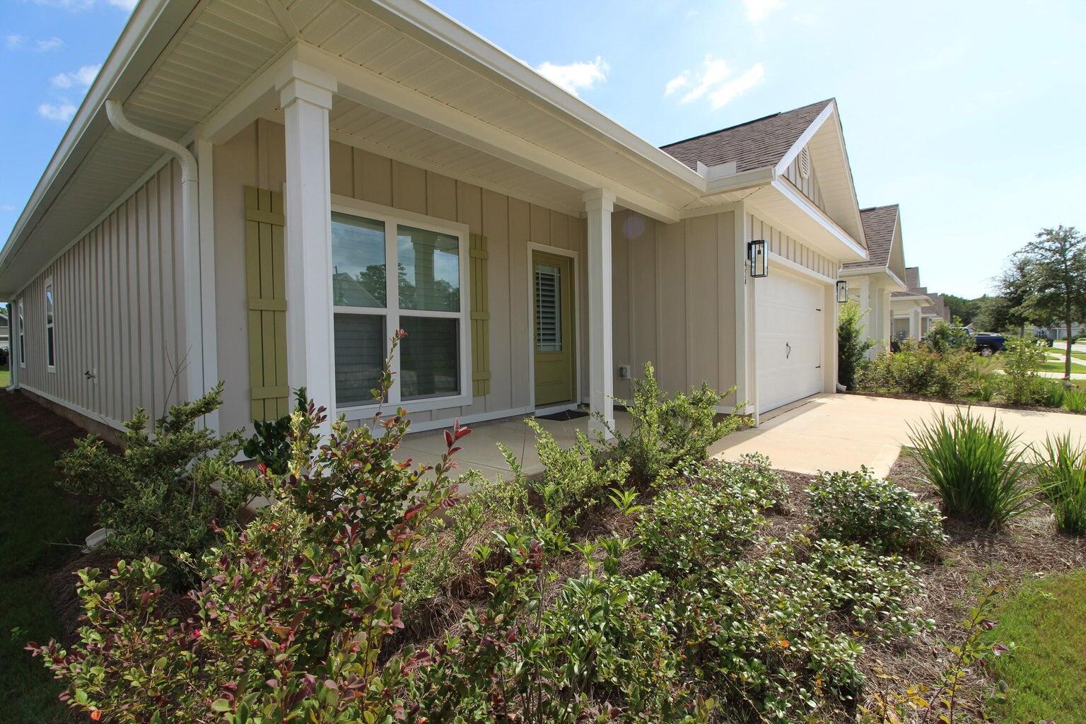 Unique floorplan in this spacious Oakley Model offers a 3/2 plus a flex room. It has 9ft ceilings througut along with a vaulted ceiling in the living room adding to its elegant style. This smart gated home,has its own community pool, pickleball, and tennis courts. Nice separation between your kitchen and living area. No couch backing up to the kitchen island! This home has over 13,000 in upgrades that include Plantation Shutters on all windows and doors, open from top bottom or both, bronze screened in porch, gutters, new garage door opener & entry keypad, includes camera that operates from your phone. Home includes an abundance of cabinetry, granite counter tops kitchen & baths & island with extra storage. Gorgeous gray tone EVP flooring. Garage comes with (SEE MORE) extra storage units and built in work space. Brushed nickel hardware, stainless appliances, upgraded refrigerator, led light package. Hardie Cement Board on exterior, vinyl soffit and aluminum facia and insulated windows. Hammock Bay has a general store(great pizza) and a microbrewery that offers live entertainment and great fun. It is a real hit and great community socail gathering place. The main gorgeous clubhouse includes Olympic size pool plus 2 other pools. They also have a gym, pickleball & tennis. If you want to fish this is the place. The walking trails in Hammock Bay offer a park like setting unique to the area. There is a Bay Pavilion and storage for RV's and boats(extra fees). This is an opportunity to purchase a home with the extras financed instead of coming out of pocket after you move in. Call Cat to view. Easy show!