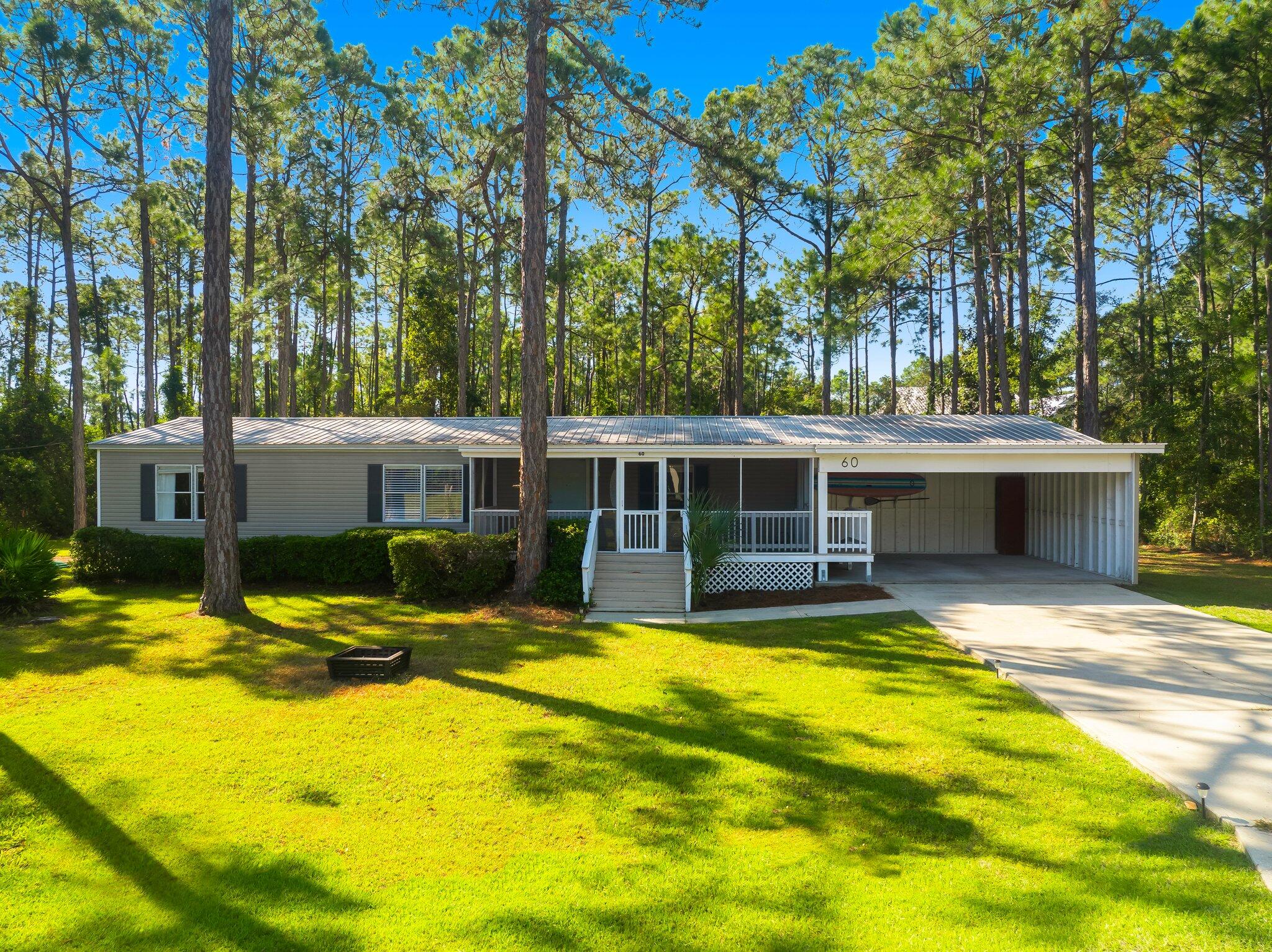 HALF ACRE OFF OF 30A! Move in or rental ready! Come and see this opportunity in an amazing location. Just a short one mile drive to the Ed Walline Beach Access and great restaurants and shopping in Gulf Place Town Center! No HOA! This property has been well kept and would make a nice second home get away, income producing rental or primary home. Large open spaces greet you as you come in the front door, leading to the kitchen and dining area. Plenty of room to entertain and unwind from those long beach days. Every bedroom has its own walk-in closet with ample space.The home also features a back porch/deck and large screened in front porch for relaxing under those beautiful trees that canopy the yard. Plenty of room to park an RV or boat and two sheds included for storage Great location, right in the heart of the 30A community, with lots of potential for immediate rental income. Or use the place personally and eventually build your own future dream home on this large lot! 