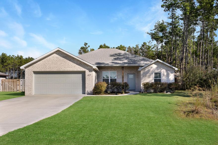 Welcome to this beautiful 4 bed/2 bath home built in 2021 designed to provide comfort and style for you and your loved ones.  Step inside and be greeted by the exquisite interior features that will leave you in awe. The LVP floors are low maintenance and create a warm entrance, the 9 ft ceilings and open floor plan allows for functionality and space for furniture and guests. The kitchen is inviting and modern with ample cabinet space and a large island that provides plenty of room for storage and meal preparation. The white granite countertops and stainless steel appliances are sleek and durable. Cozy up by the electric fireplace in the open floor plan living area, creating the perfect spot to relax and unwind after a long day. The primary suite is a true retreat, boasting his and her