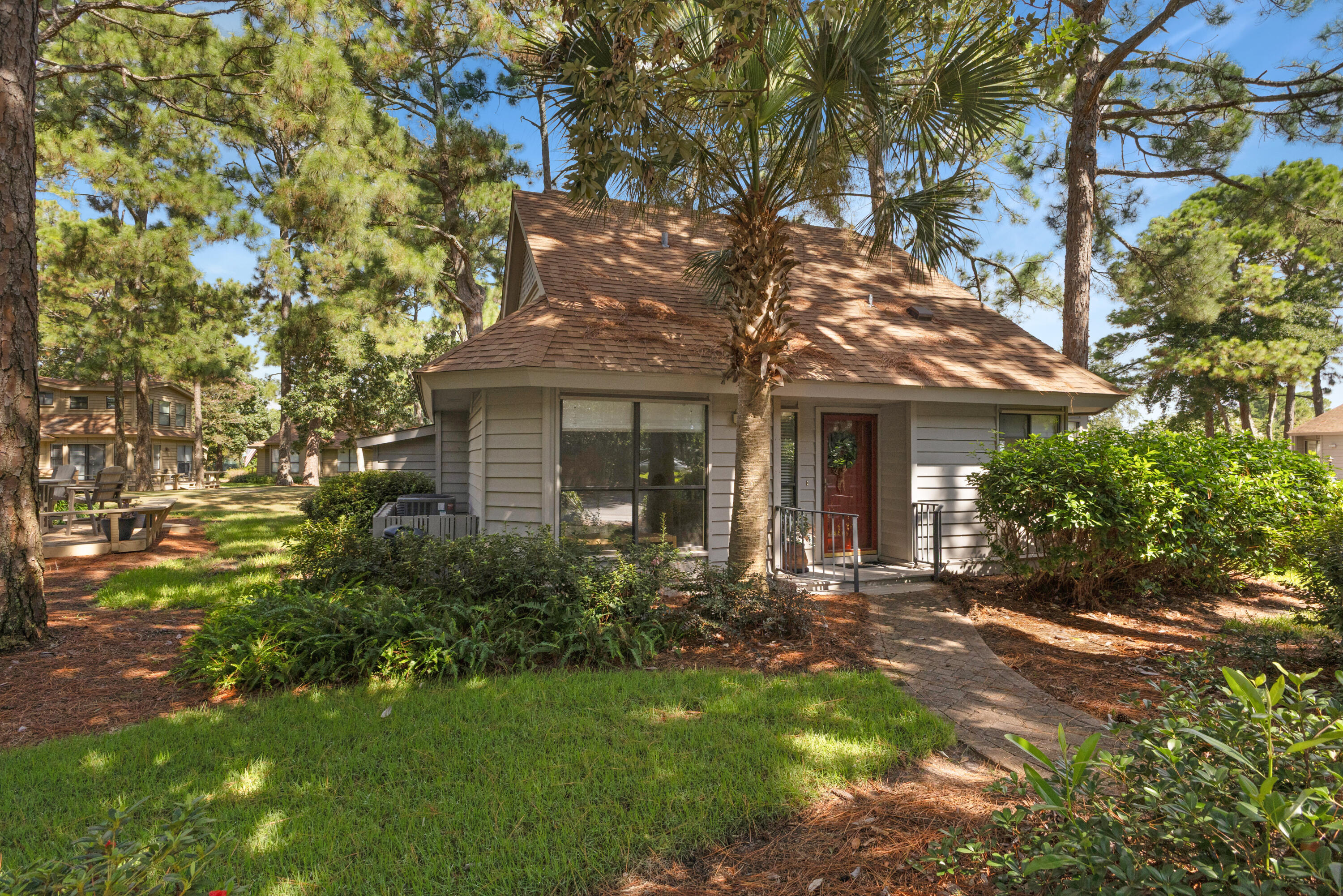 Charming Cottage in the Fairways of Sandestin Golf & Beach Resort!!Tucked away on a peaceful wooded corner lot, this rare Fairways cottage offers a perfect blend of privacy and resort living. Located just off the 8th tee box of the Links Golf Course, the home's spacious screened porch and deck provide beautiful views of the fairway as it stretches toward the Choctawhatchee Bay. In the evenings, you'll be treated to most spectacular bay sunsets. Inside, the 3-bedroom, 3-bath layout has been thoughtfully maintained by its original owners. Previous updates include all-new plumbing, a roof replacement in 2016, HVAC in 2013, and a master bath renovation in 2015. Ample interior storage plus an additional outdoor storage room make it easy to keep everything from bikes to beach gear organized.
A short golf cart or car ride takes you to all of Sandestin's incredible amenities, including pristine beaches, championship golf, world-class dining, shopping, and entertainment. This is a rare opportunity to own a beautifully kept home in one of the area's most desirable gated golf course communities.
Fairways owners enjoy access to the two heated SOA pools: One across from Linkside Village on Audubon Drive (Currently Under Construction) and the newly constructed Phil Hummel Aquatic Center centrally located at the Baytowne Ave Traffic Circle.
As an introduction to the Sandestin lifestyle, we invite our new owners to explore amenities that make Sandestin special. The listing brokerage and seller(s) are presenting the buyer(s) of this property with (2) 90-minute rounds of Tennis court time, a golf foursome at one of our three championship courses, and a round of golf for up to four (4) players at the unrivaled Burnt Pine Golf Club.
Sandestin Golf and Beach Resort features more than seven miles of beaches and pristine bay front, four championship golf courses, 15 world-class tennis courts, a 226-slip marina, a fitness center, spa and celebrity chef dining. Shop, dine and play at the charming pedestrian village, The Village of Baytowne Wharf and more. Inside the gates of the resort, residents enjoy a balanced lifestyle of high-class living, spanning the 2,400 acres from the beach to the bay. Everything within the gates of the resort is accessible by golf cart or bicycle. The entire resort is interconnected by miles of pedestrian, bike and golf cart paths that weave through groves of live oaks, meandering past natural lagoons, fountains, man-made lakes, and meticulously landscaped fairways.