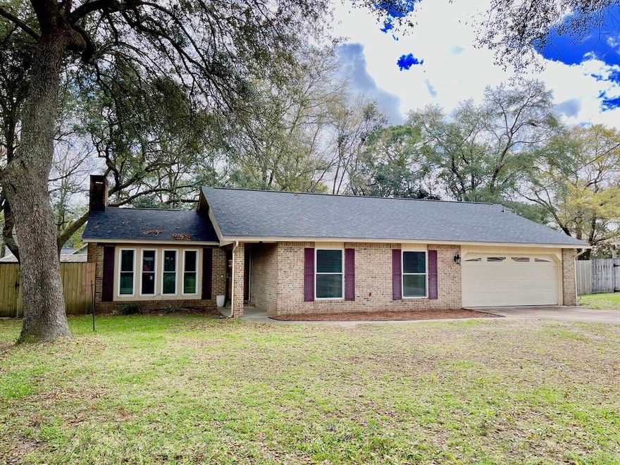 TASTEFULLY updated home on a .41 acre private wooded lot in the center of Niceville!! Located in Baywood Estates, this home is close to everything including a convenient boat ramp off of Edrehi that is only .20 miles away that allows you easy access to Rocky Bayou. This 3 bedroom, 2 bath home has been updated the past few years with a NEW roof, NEW kitchen, LVP flooring in the living areas, carpet, paint and fixtures. According to the previous owners, the windows were replaced with impact windows in 2018, the HVAC in 2016 and the water heater in 2009. The large back yard offers a screened area with a hot tub (conveys AS IS) as well as two yard buildings and a play set for the kids. All the work is done and this home is ready for you to move in and make it your own!!