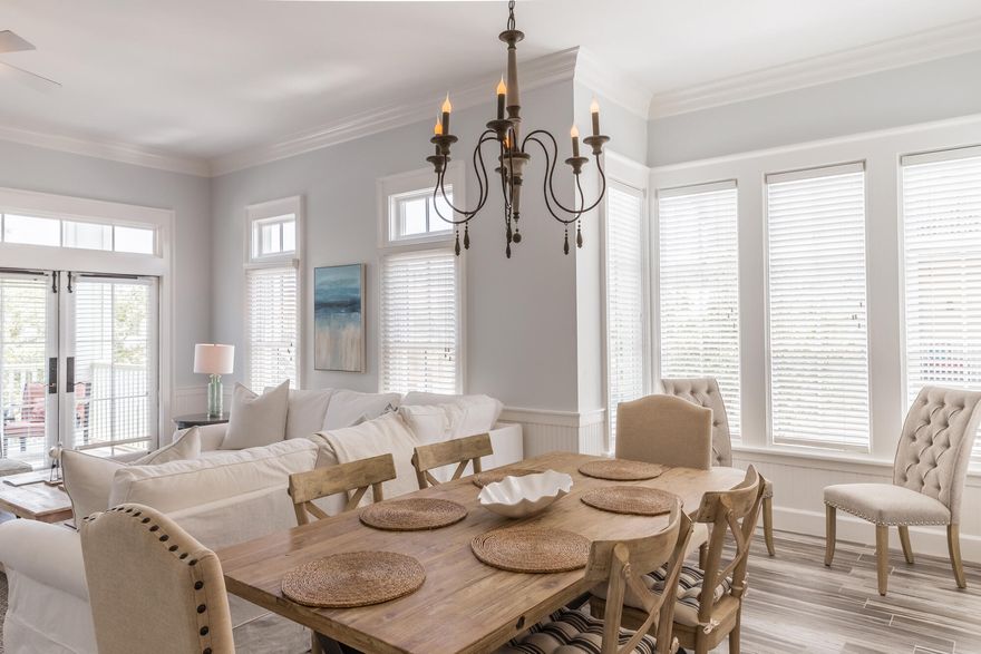 REAL GULF VIEWS! Freshly painted, new porcelain flooring, and new furnishings even on the two porches overlooking the Gulf.  Relax and enjoy your favorite beverage looking through the newly expanded Watercolor Beach Club straight to the Gulf of Mexico. This condo provides a perfect vacation getaway.  Occupying the second and third floors directly above the Watercolor Shop, the unit features exceptional 11 foot ceiling heights with crown molding and natural light streaming through the oversized French doors and transom windows. The chef's kitchen features stainless steel appliances and white cottage-style cabinetry that perfectly complements granite countertops. Wood flooring on both floors and the stairs, tile in the 2-1/2 baths, shower doors, wood shelving, tv's, and lighting throughout.