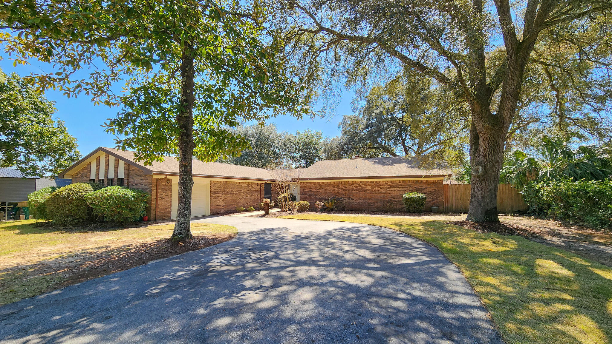 NEW ROOF + GUTTERS! Spacious brick home in Poquito Bayou is ready for a new owner! Large lot! Entry has views into the large living area with brick fireplace + custom built-ins. Formal dining and U-shaped kitchen w/ breakfast area are around the corner. Kitchen has ample cupboard space and newer tile. 4th Bedroom was created off for additional SF and could be used as a bedroom, office, etc. Heated & Cooled Florida Room off the living room with raised ceiling provides natural light from your fenced in backyard. Master Suite is spacious with large bathroom with double vanity, separate shower, jetted tub, as well as walk-in closet and access to the laundry / storage room. New carpet, freshly painted interior HVAC 2019. Water Heater 2025