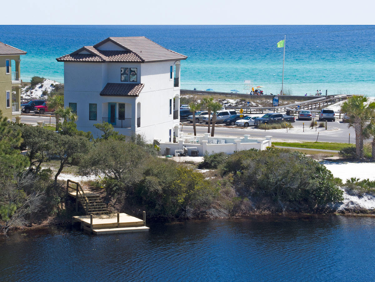 This knockout 6-bedroom rental machine is a prime investment opportunity that's in a class by itself. Rarely do you find this coastal elegance with unobstructed Gulf views, 100 feet of lake frontage, and exceptional rental figures down 30a! 30A Morning Surf is ideally located in Dune Allen Beach directly on 30A and was professionally furnished by Coastline Luxury Interiors. Some of the numerous well-appointed highlights include: Private elevator, quartz countertops throughout, stainless steel appliances, plantation shutters, mounted flat screen televisions throughout, spacious third floor master suite with unobstructed Gulf views, floor-to-ceiling stacked stone gas fireplace, walk-in Master shower and free standing cast iron tub, and much more. Every bedroom is uniquely designed...