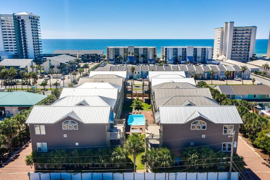 INVESTORS DREAM!! The home has Rental Projections Exceeding $85,000 Annually! Sold fully furnished and rental ready!UPDATED 4 Bedroom 4 Beathroom home located in one of Panama City's Premier ocean communities! Panama Dunes!   Balconies overlook a quaint little courtyard with in-ground pool, grill / picnic area, and hot tub. Just 2 blocks from the Gulf and close to amenities!