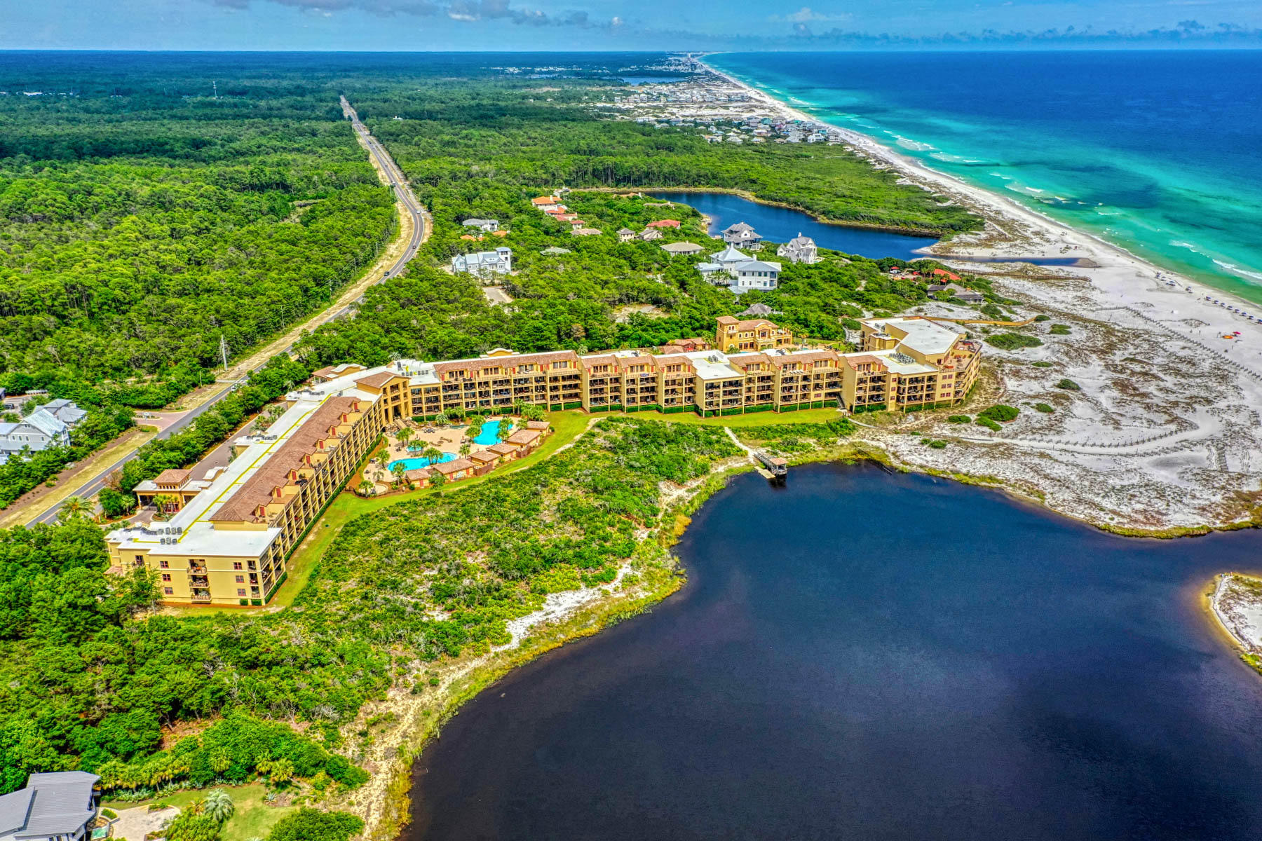 Sanctuary by the Sea is a gulf front resort that is spread over 23 acres and has only 82 units. A pool cabana will convey with the purchase of this unit. Gated with 24 hour security, underground parking, 3 heated swimming pools, workout center, owner's lounge, grilling station, fire pit and much more. Enjoy over 600 feet of pristine, white sandy beaches on the Gulf of Mexico and one of the coastal dune lakes, Big Redfish Lake on the west side. With over 3100 sq ft, this 4 bedroom, 4 1/2 bath is on the 3rd floor which overlooks the oasis of pools, cabanas, lake and gulf views. Travertine flooring throughout the unit with exception to the bedrooms. Granite countertops on all bathroom vanities and kitchen counters. Large center island with vegetable sink, bar-hop countertop with seating for 4-6, stainless steel Viking appliances, gas range & gourmet hood. Nice sized laundry room with full size stackable washer and dryer. 10' ceilings, 8' doors, large baseboard and crown molding. Designed to have two master suites, both with gulf and lake views. The 3rd story can be used as and additional master suit which is currently being used as a bunk / game room. Unit is fully furnished and on the rental program with Vacasa Rental. Unit can only be shown when vacant or turnover days. Interior pictures to come after March 1