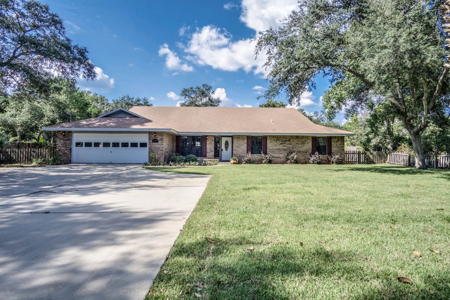 Welcome home! Beautifully renovated home with Brand New Roof and new landscaping on a .73 acre lot in Destin! The Keyless entry front door leads you in to hardwood floors, a formal dining area, and the family room with a wood-burning fireplace. The kitchen has updated stainless steel appliances, new counter-tops, USB charging outlets, with plenty of cooking space. The large master suite features 3 walk-in closets, new double vanity, Jacuzzi tub and stand-up shower. The great rooms is very spacious with wet bar, guest bathroom and French doors leading to the back deck where there is plenty of room for a pool. This home is a ''Must See'' to appreciate! Don't hesitate  call now to be the first in line for this incredible value!