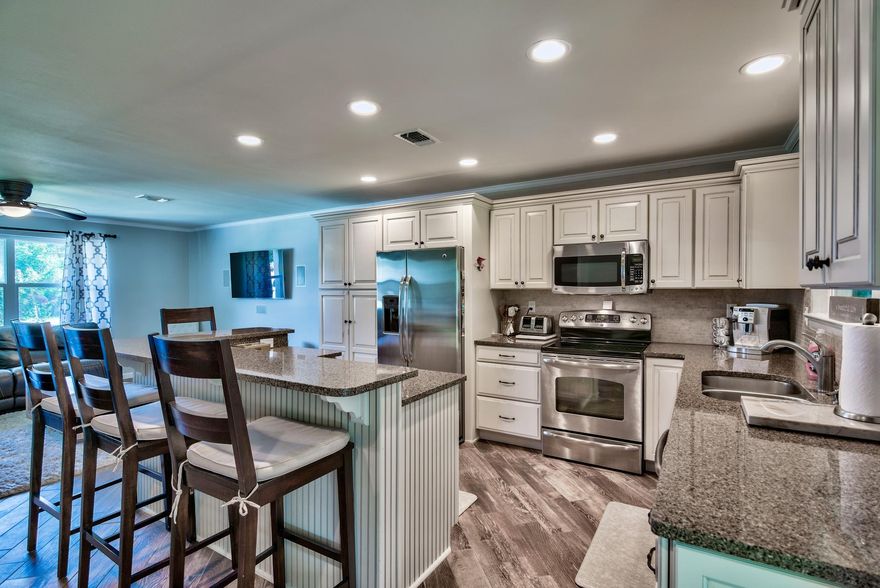 RENOVATED HOME in the HEART of DESTIN, FLORIDA! This property is close to the Sugar White Sands and green waters of the Emerald Coast! Kitchen features quartz counter tops, stainless appliances, a wine refrigerator and is open to a spacious great room. The covered deck has a beautiful wood ceiling and over-looks a huge backyard that is large enough to accommodate a pool. Tile is throughout the living area and the bedrooms are carpeted. The master bath has an over-sized tiled shower with rimless glass doors and double vanities. Neutral paint is throughout. This home is close to great shopping, dining, public boat launches, and many other amenities in the area. Seller is providing a 1 yr. Home Warranty. Buyer to verify all lot and home dimensions. EFFECTIVE AGE OF HOME is 2005. A MUST TO SEE