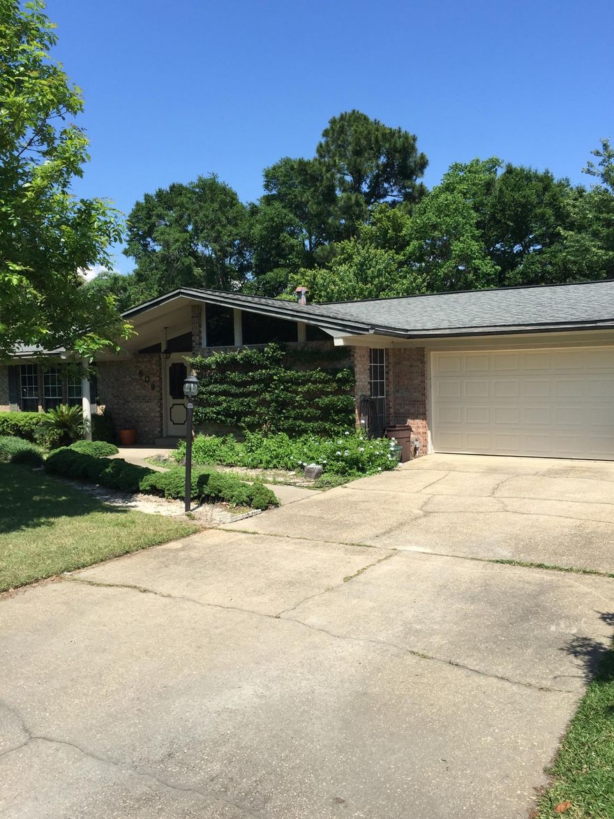 Great curb appeal. Single-story brick home built in 1980 and designed for privacy. Covered entry porch provides for a stately welcome into the spacious foyer. Large''living room'' is on the left but could also serve as a roomy game room. A separate dining room sits to the right. An Open kitchen has: a breakfast bar, double pantry closet and a central serving bar; all with views into the family room with a fireplace and French door to the rear patio and yard. Bedrooms are situated at the rear of the home. A 29 ft. deep garage to accommodate large vehicles or recreational vehicles. Lot offers plenty of potential, without much work. Sold with limited AHS Home Warranty provided by Seller. Some repairs are in progress.