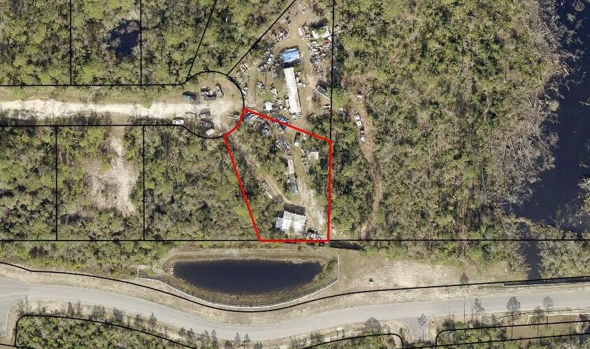 Hickory Bluff, named for the trees and high and dry land, here is a building lot, ready for a new construction or mobile home. Surrounded by new homes and a short distance to Fanning Bayou, fishing, boat ramp and just a few miles from Lynn Haven. The lot has with no association fees so bring your boat, RV, build a pole bar or workshop. Peaceful, quiet and ready to go today! Choose from any of the many lots we have for sale in Hickory Bluff community! Call for additional details.