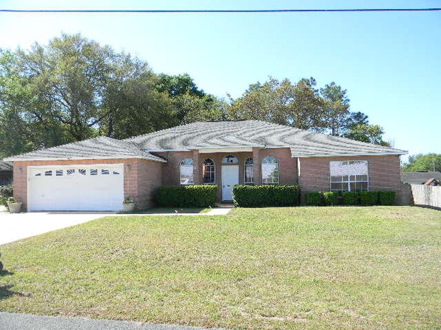 STOP..LOOK..BUY THIS HOUSE!!! GREAT 4BR/3 BATH, 2509sf ALL BRICK HOME, SOUTH OF I-10 & CLOSE TO ALL BASES, SHOPPING ETC!!! Step inside to large tiled flooring through all rooms but bedrooms, even the screened patio is tiled!! To the left of entrance will be the formal dining, to right- office, playroom etc. Straight ahead, walk into the large family room with fireplace, French doors leading to enclosed patio, to left will be breakfast room & kitchen. And wait till you see the new granite countertops! Plenty of countertop & cabinet space along with pantry & even storage in the island!! Across from the kitchen will be the laundry & hall to Master Suite. Double marble vanity, separate shower & whirlpool tub with his & her walk-in closets. New carpet has just been installed in Master.