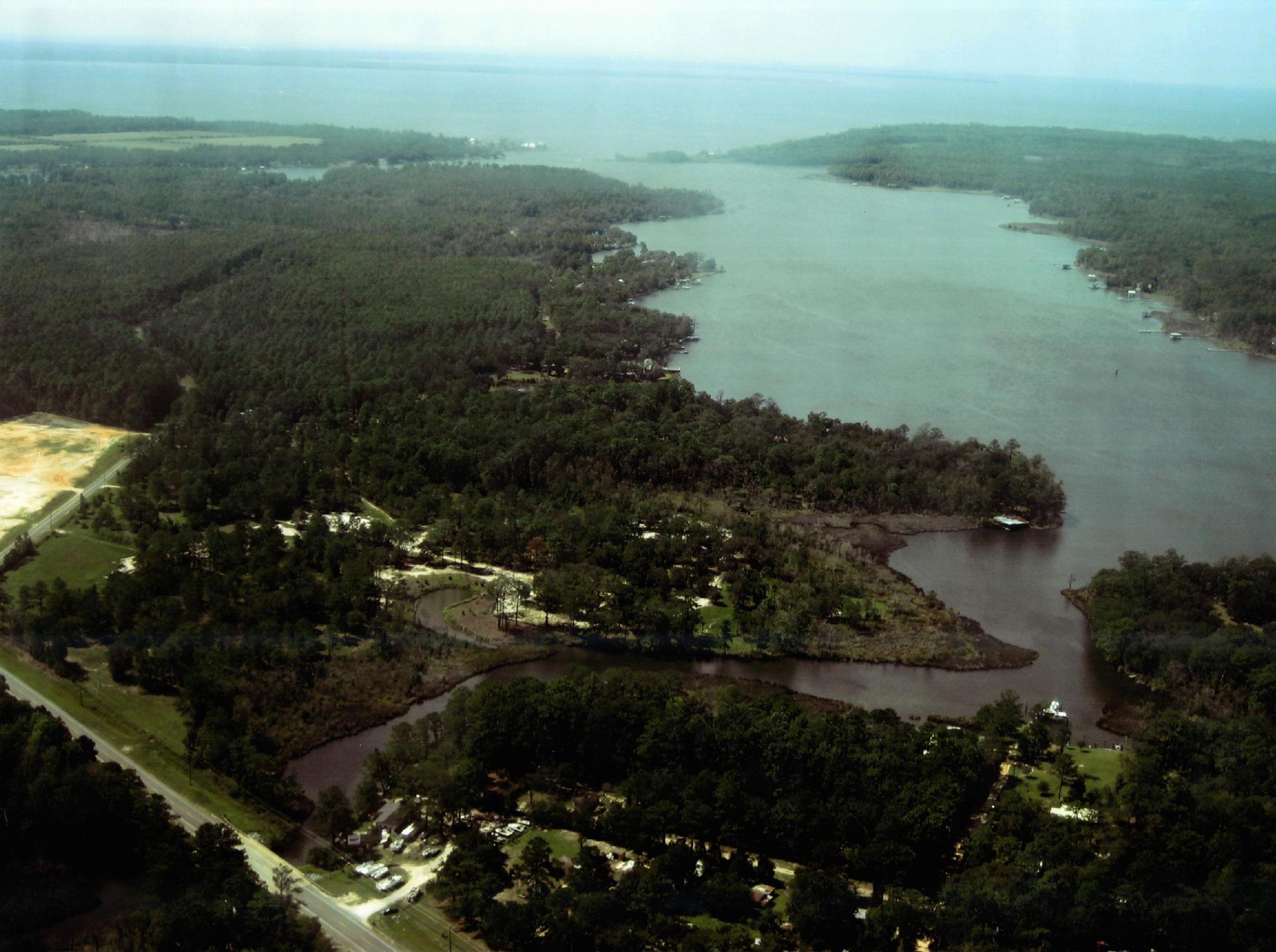 This 34 +/- acre development is located approximately 1.7 miles south of State Hwy 20 on US Hwy 331 South and approximately 3 miles north of the Choctawhatchee Bay from the Clyde B. Wells Bridge. Potential opportunity for commercial and/or residential development with access to the Choctawhatchee Bay along a growing corridor of Walton County with average AADT between 17-18K cars per day. This development consists of 10 parcels. perfectly situated in a HIGH TRAFFIC corridor with potential for marina, homes, & commercial, etc.