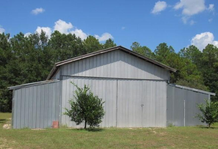WORKSHOP-1 Ac- 3/2/1 car garage in the Auburn community. The home is just the right size and the workshop is oversized, for all the carpenters, handymen, and mechanics. There are pear trees, citrus trees, peach trees and blueberry bushes.  Partially fenced yard for pets and children to have plenty of room to roam. Schedule your appt soon!