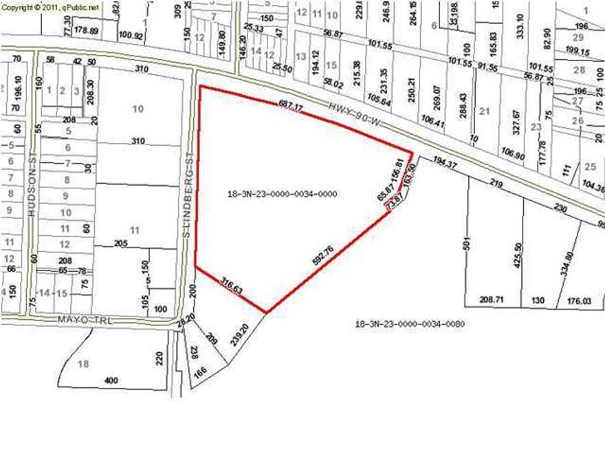 10 acres of land located on Hwy 90, approximately 823 feet of Highway Frontage, plus an additional almost 700 feet running south along Lindberg. The Future Land Use is Mixed Use and the Zoning is not designated. Mixed use allows for residential (single & multi-family) and commercial uses. Please verify information with the City of Crestview. Property is wooded, has a gentle slope from the highway, and appears to border a small pond on the south side. Acreage is rounded to 10 acres, the actual is 9.96 acres according county records. Lot depth is estimated (measured from county site, at approximately its deepest point).