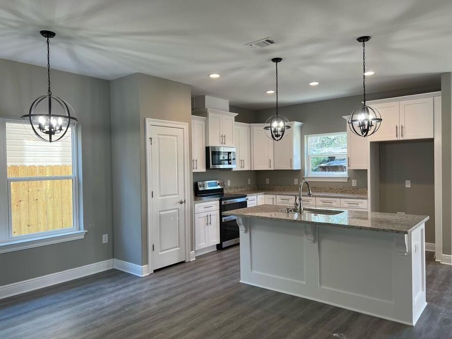 NEW CRAFTSMAN Custom Built Home in EAST NAVARRE~Under construction and ready for your summer move in ~Great Location with easy access to Navarre Beach ,local stores & Hwy 98 to Hurlburt Field AFB.This Stunning Robbins Builders Home offers trend setting Features~Greeted by a walk in foyer sweeping through to your open floor plan~Large kitchen enjoying all wood white Shaker cabinets with crown molding, beautiful GRANITE counter tops~Under mount sink~S/S appliances~Center Island or breakfast bar ,offering plenty of work area & open flow to the dining area and large family room.Gorgeous luxury vinyl plank flooring throughout. Master bedroom is a great size with & Large Master bathroom offering ~ oversized TILED walk-in shower ~Granite vanities with rectangular under mount sinks