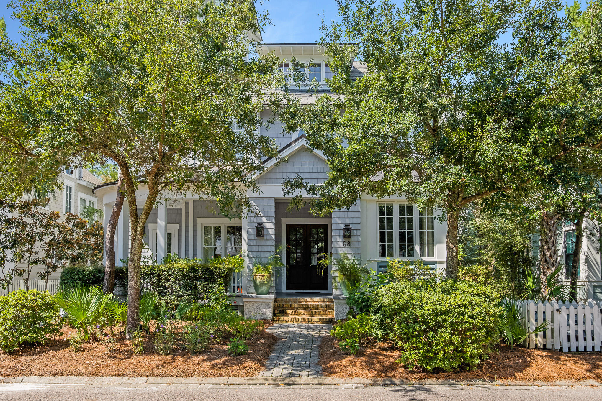 This beautiful award winning WaterSound Beach home is now available for purchase.  Deer Lake State Park borders the home to the West offering added privacy not found in many other lots in the community.  The private pool creates a backyard oasis for cooling off on warm afternoons.  The reclaimed hardwood floors and antique beams create a timeless feel that smoothly meshes with the beachy feel created by the bright colors and natural light found throughout the home.  The Main floor living with the gourmet kitchen is complete with dual dishwashers, steamer, built in Miele Coffee Maker and oversized refrigerator.  The fireplace accented by Chicago Brick anchors the living room.  The first floor is rounded out by a guest suite, formal sitting room and mudroom.