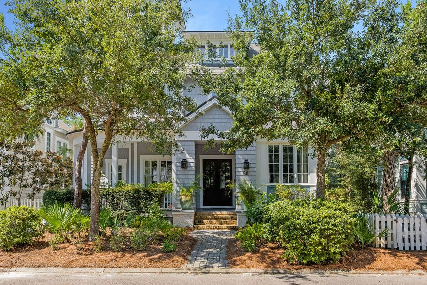 This beautiful award winning WaterSound Beach home is now available for purchase.  Deer Lake State Park borders the home to the West offering added privacy not found in many other lots in the community.  The private pool creates a backyard oasis for cooling off on warm afternoons.  The reclaimed hardwood floors and antique beams create a timeless feel that smoothly meshes with the beachy feel created by the bright colors and natural light found throughout the home.  The Main floor living with the gourmet kitchen is complete with dual dishwashers, steamer, built in Miele Coffee Maker and oversized refrigerator.  The fireplace accented by Chicago Brick anchors the living room.  The first floor is rounded out by a guest suite, formal sitting room and mudroom.