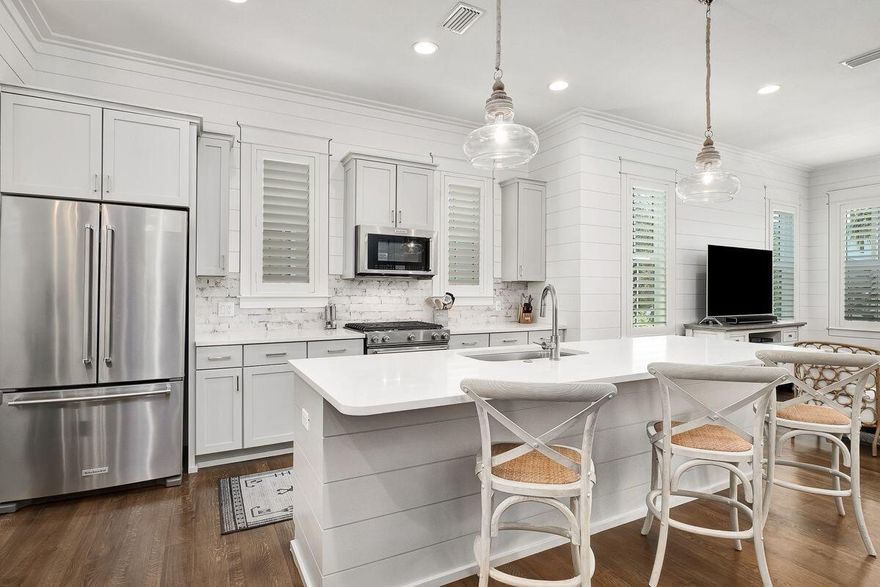 Unique opportunity to own this ultra updated Cole custom home in desirable Lakeside at Blue Mountain Beach. This home is currently a primary residence however is projected to gross $70,000 in rental income. The office space could easily be an added bunk room.Notable upgrades including: Shiplap throughout. Including:  new fixtures and hardware in kitchen and bathrooms, quartz countertops, custom lighting, sinks, backsplash, pebble inlaid shower floors, plantation shutters, all new paint throughout, gutters, screened in upper porch, stone paved back patio, stone paved driveway, all new appliances, heat pump, tankless hot water heater, baked diamond grind garage floor.