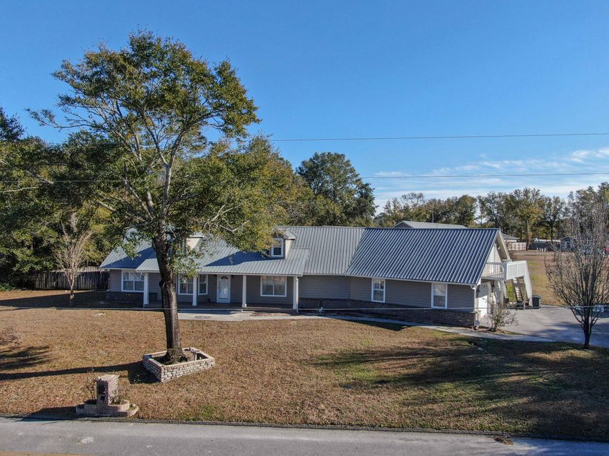 CUSTOM BUILT HOME This stunning four-bedroom home with inground pool is located less than a quarter mile from the Lake Juniper public boat ramp.   The   home has many upgrades including hardy plank siding, vinyl wood plank flooring, stainless steel appliances, custom lighting, custom kitchen cabinets, breakfast nook with built in bar, sink and mini refrigerator, a Florida room that overlooks the pool, a screened in patio that also overlooks the pool, and an oversized laundry room with sink and enough room for an additional refrigerator and freezer.   A huge open second floor includes a bedroom area with half bath, an office area and a huge game room area.  The almost one acre of land consists of two lots and one of which is totally vacant with separate paved road frontage. Shown by appt