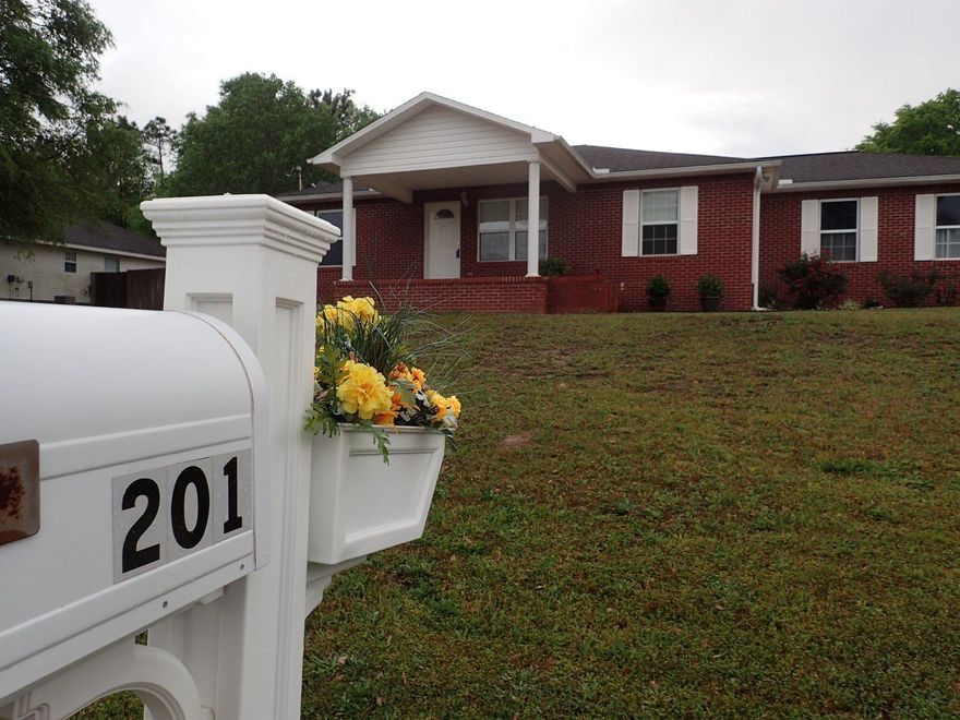Welcome home! Talk about convenient and priced to sell! This home is super cute and ready to go! This 2002 home has large front porch, brick front, side entry 2 car garage and privacy fenced back yard. Living room has vaulted ceilings which make this home see much larger than its 1247sf. Split bedroom design, the master and all bedrooms have new carpet. Laminate floors can be found in the living room and hall and tiled floors in the kitchen, laundry, and baths. Home comes equipped with stainless steel upgraded smooth-top stove, full tub dishwasher, side by side fridge and rangehood. Plenty of storage space in the kitchen in the panty as well as indoor laundry. Back yard is plenty big enough for the kids and pets! Much to see before its gone!