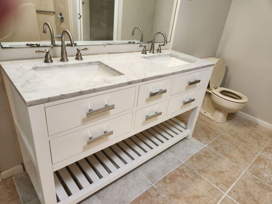 Newly & totally renovated from floor to ceiling. Kitchen is all wood & granite.  Bathrooms with new double sink vanities with quartz.  LOTS OF CLOSETS & STORAGE.