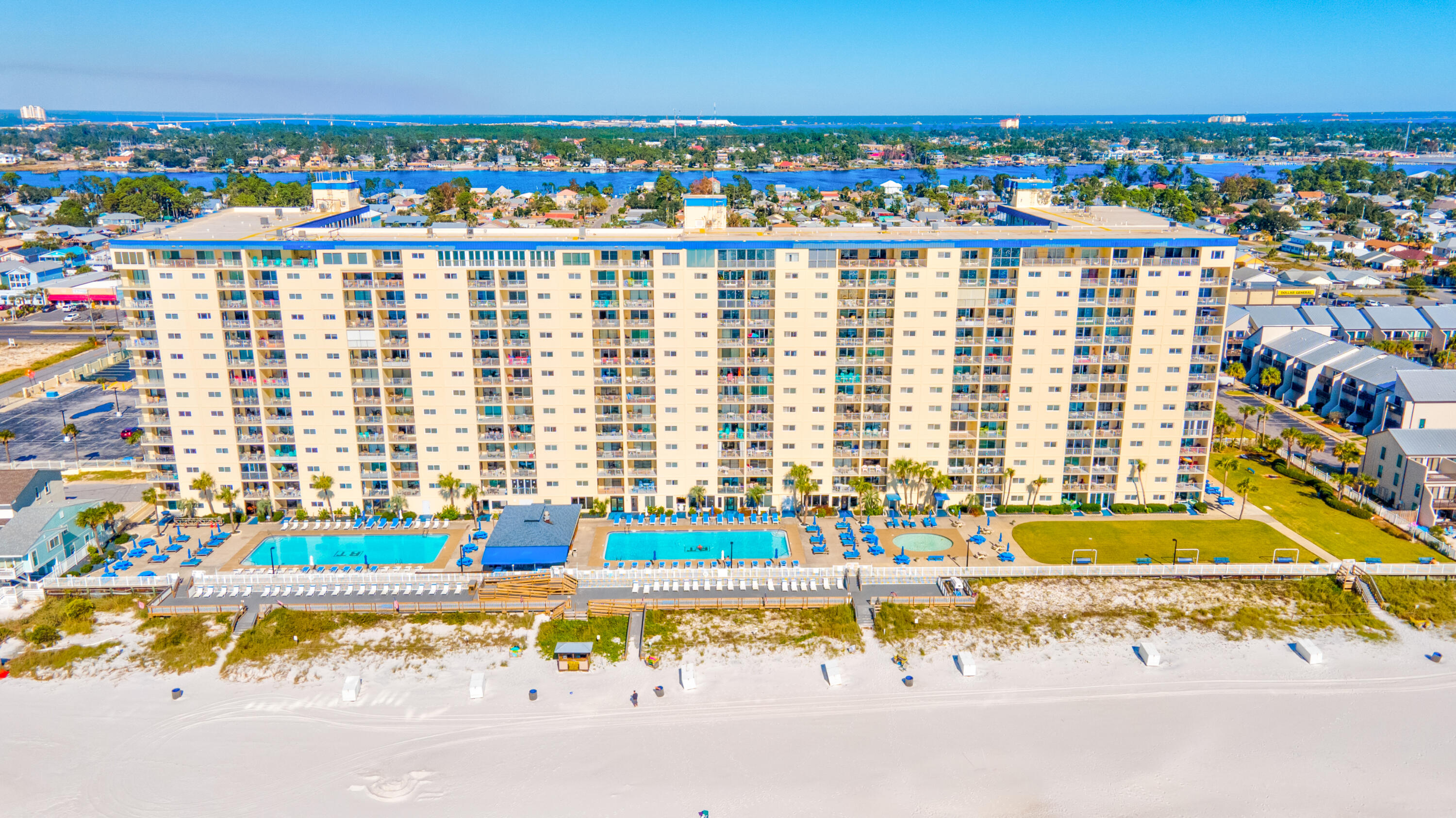 ALERT! MASTER ON THE GULF WITH WINDOW THAT OPENS TO HEAR THE GULF BREEZE. YOU ALSO HAVE A PRIVATE DOOR FROM THE MASTER THAT GOES TO THE PATIO. This fully furnished, and stunning 2 bed 2 bath condo is located on the popular East End of PCB Beach! REGENCY TOWERS HAS IT ALL! TWO LARGE POOLS AND SUPER COOL TIKI BAR AND EATERY ONSITE/POOLSIDE. The other amenities at Regency Towers are second to none, with a fitness center, hot tub, and game room just steps from your front door. The living area is bright and airy, with plenty of natural light pouring in through the large windows that overlook the Gulf of Mexico. You'll love the easy flow from the living room to the kitchen, which features plenty of storage space for all your culinary needs. Both bedrooms are spacious and comfortable.