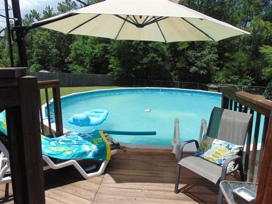 8-year-old, quality built brick beauty on half acre in lovely Pleasant Ridge Estates. This well-cared-for home has a great room/open floor plan with tons of flexible living and storage space. Durable, low maintenance finishes, energy efficiency and close proximity to the Interstate free your time to enjoy the beaches, shopping and dining of South Walton as well as historic DeFuniak Springs (within 5 miles of I-10 and 30 minutes to the beach)! Amenities include continuous dark gray wood-look porcelain flooring, matching stainless appliances, fresh paint, pretty landscaping, pool with adjoining deck, extra-large master, trussed and screened lanai, and very private rear yard.