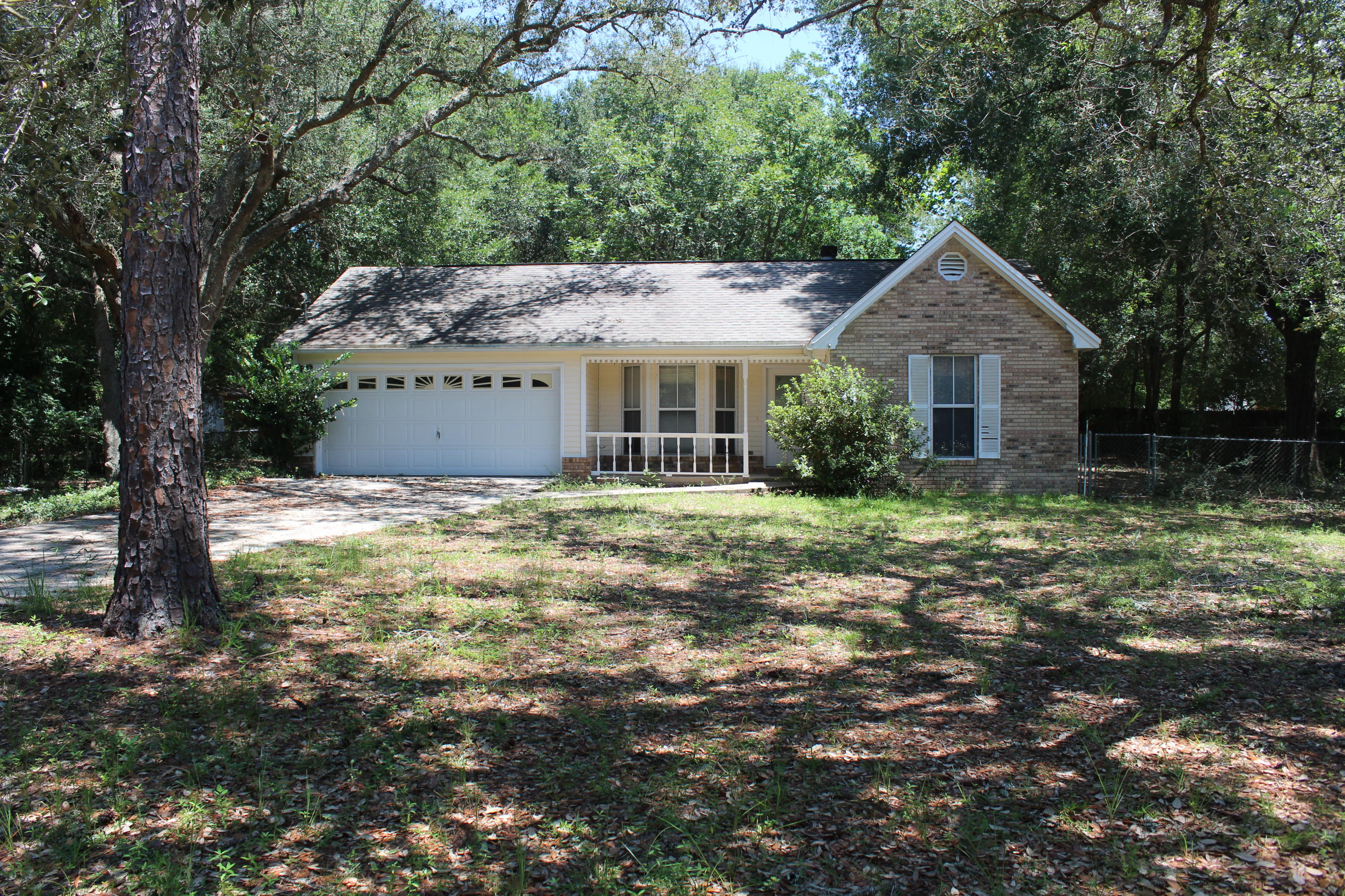 Great starter home located in South Crestview. This home offers a split floor plan with 3 bedrooms 2 baths. Master bathroom has a walk in shower. Tile in living room, kitchen and baths with carpet in all bedrooms. Nice big chain linked back yard. Roof was replaced in 2014 with Asphalt/Fiberglass Shingles.