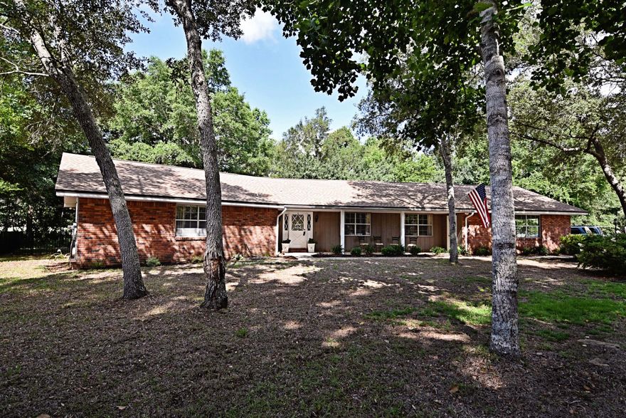 Come see this lovely, sprawling, one story ranch in highly desirable Rocky Bayou Country Club Estates. No HOA fees on this home! With the 14th Tee backing the property, the gracious landscaping invites you to stay outdoors in the fenced backyard that's perfect for kids and pets. Situated on 1/3 of an acre featuring mature trees and landscaping, you have no traffic to worry about as you are nestled at the end of a cul-de-sac! From the moment you step inside, the open airy feel of this updated home will make you feel that you belong here. Note the beautiful hardwood flooring in most areas, the three bedrooms, two and a half baths, spacious kitchen, eating area and formal dining room. Two sets of French doors open from the family room onto the large covered back porch that adds so much room for entertaining. The living and family room areas offer plenty of space to spread out and enjoy different activities. This home is perfect for a growing family or anyone who needs a lovely home for welcoming guests and entertaining. The pictures can't tell the whole story, so schedule a showing now!